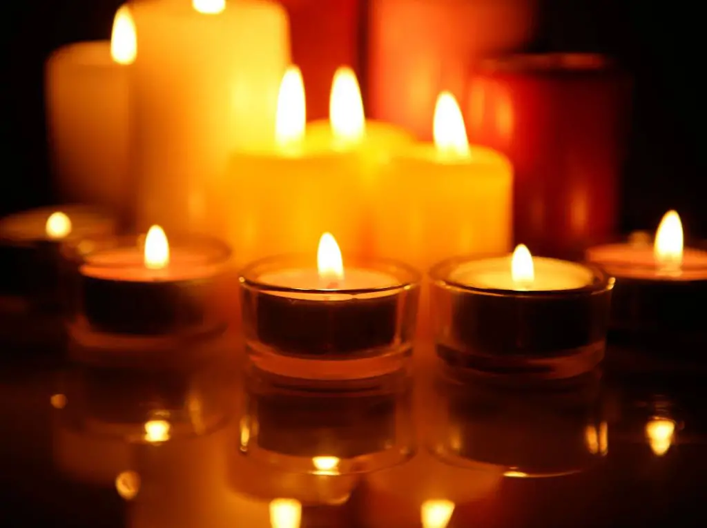 What does candle lighting symbolize?