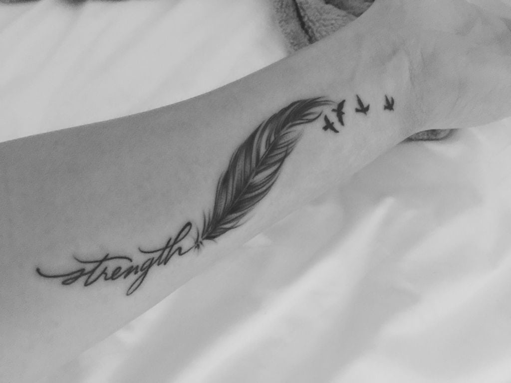 What does a feather tattoo mean strength?