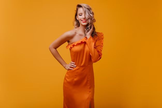 What can I wear with an orange dress?